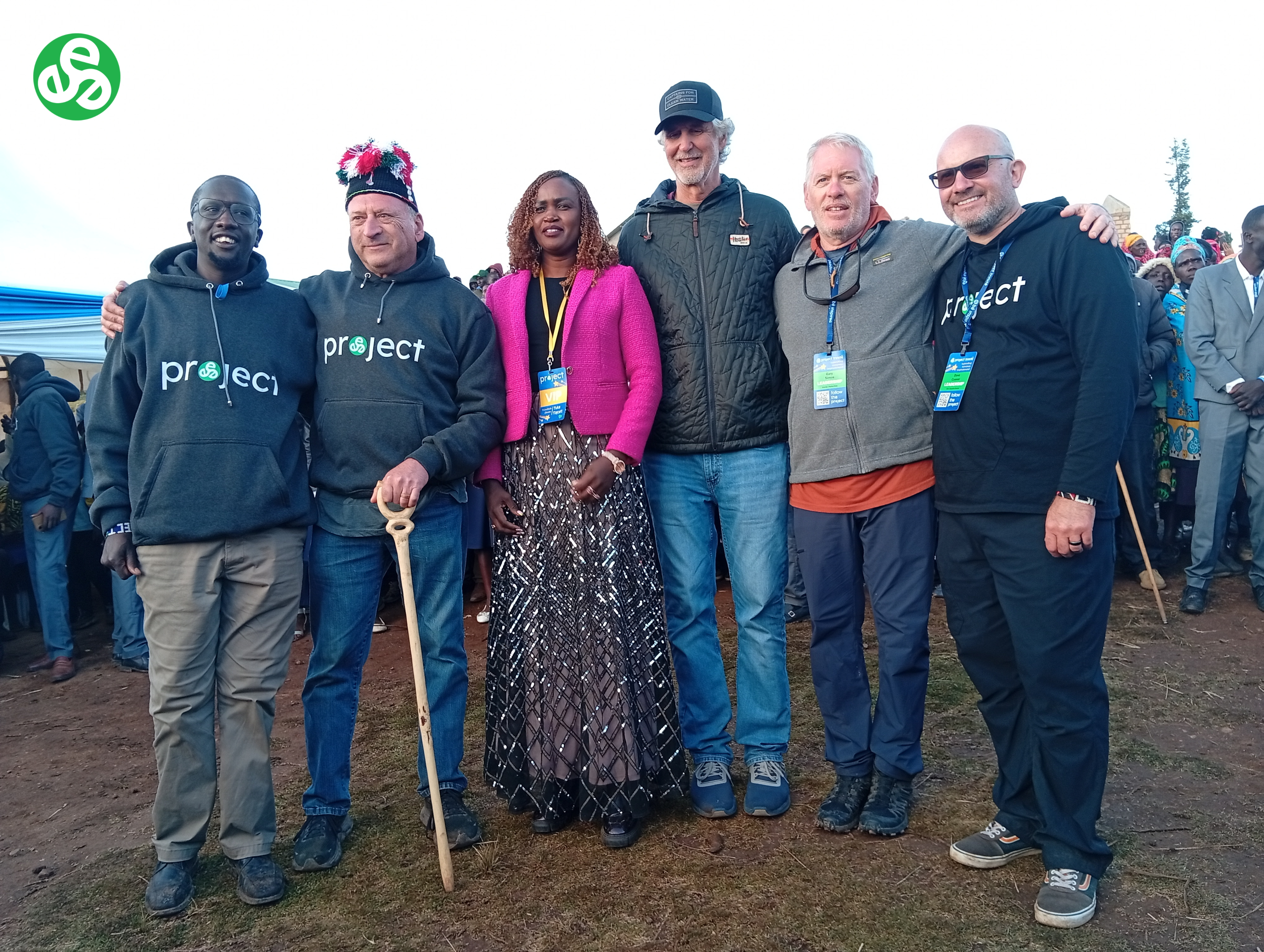Project Trinitē team members and local partners standing together at the grand opening celebration of the David Connor Trinitech Center.